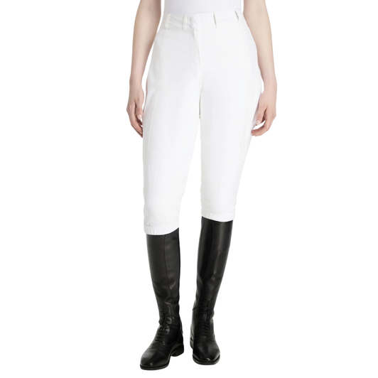 Made for quick changes at rainy competitions, these 3/4 stretch breeches with tapered leg fit are made to wear over your white breeches on wet days.

Full zips on each outside leg seam make them quick and easy to put on and take off over boots. Adjustable popper fastenings at the hems and waist offer a comfortable fit. A silicone grip on the inner hem cuff grips your boot to prevent riding up. 

A raised, elasticated centre-back waist offers a flattering tapered fit with added comfort and splash protection. Small silicone knee grips on the inside leg lend a little stability when riding in the warm-up ring.