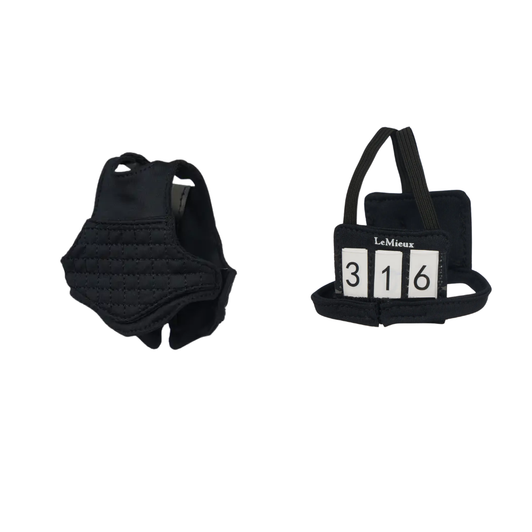 Get ready for Eventing! Now your Toy Rider can take on the biggest and wildest XC courses in this realistic body protector and number bib set.

The body protector features hook and loop closures, just like the real thing, while the number bib has interchangeable numbers for realistic play.

LeMieux toys help little equestrians create authentic scenes for absorbing and imaginative play.

Suitable for ages 3+