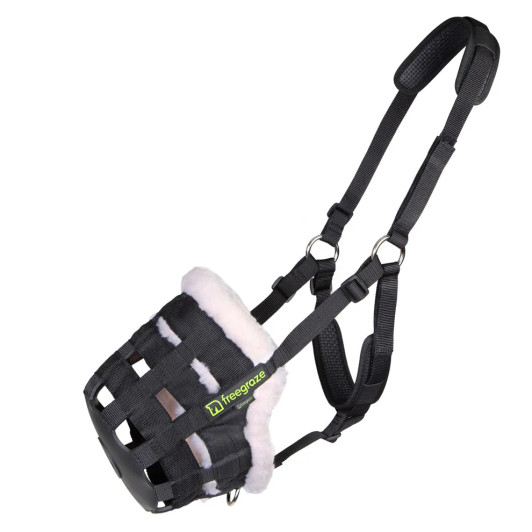 Shires grazing muzzles are proven to help with controlled or restricted feeding regimes and special diets. The Comfort Grazing Muzzles are cut back under the chin to avoid unnecessary pressure and improve the fit. The muzzle features a rubber base with a hole in the bottom through which grass can enter, reinforced nylon web bars which allow free air exchange and the anti-chafe padding around inside of the muzzle protects the delicate nose and chin. The fully adjustable harness benefits from anti-chafe padding and is fitted with a field safe fastening. A D-ring allows a lead rope to be attached. This Deluxe version is lined with synthetic wool which helps protect against chafing and improves airflow around the delicate nose area.