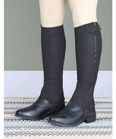 Constructed in amara fabric these half chaps offer excellent grip even when wet and great durability. Elastic full length inserts, full length zips, elastic foot stirrups, stretch zip tidy straps, bound edges.