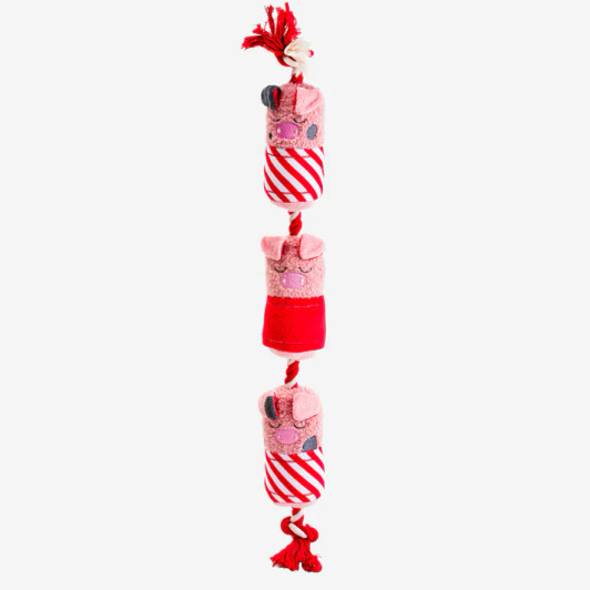 Revel in holiday joy and give your pet a precious gift this season. House of Paws' Party Animal Pigs in Blankets Christmas Toy features three little pigs in blankets, each with its own squeaker, connected to one another by a sturdy rope, perfect for tug-of-war or chewing.