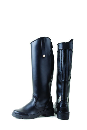 These wider fitting long boots are made from a synthetic (non-peel) material fully lined with full length centre back zip, tab closure to the side and an elasticated rear panel for size variation. The use of this stretch panel makes these boots ideal for a wide range of leg shapes and ensures more flexibility in the leg whilst you are riding. There is also a neoprene join above the foot to ease bending and help prevent stress on the boot. With reflective inserts at the heel for increased visibility and a non-slip sole for safety.