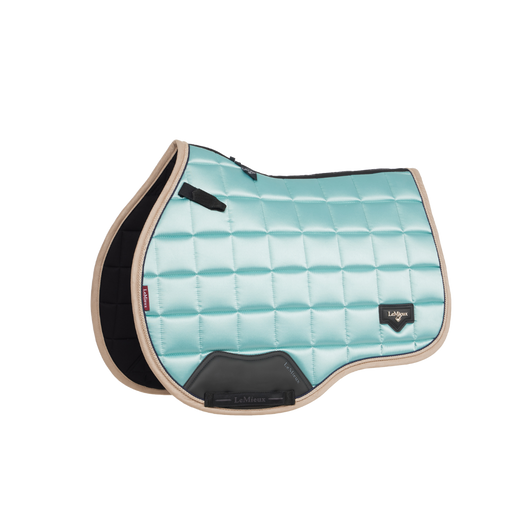 Described as the most stylish saddle pad LeMieux has ever produced, the Loire Collection exudes sophistication and style, while delivering technical advancement.
Woven Loire satin upper benefits from a wonderfully soft and breathable natural bamboo blend lining. The bamboo material controls heat and wicks efficiently to keep your horse cool under the saddle.
The high wither shape reduces pressure and enhances the fit of your saddle. Elasticated saddle straps are slimmer at the point of connecting to the D-ring, leaving room for extra accessories.
The whole pad benefits from an extensively-researched, soft, friction-free binding which is specially fabricated to smoothly contour the edges. This new technique helps retain the perfect saddle pad shape and binding profile.
The textured faux leather girth protection area is complemented by an embossed logo and carries the usual signature LeMieux lower girth strap with its inner girth loops.
A unique LeMieux logo metal badge on a leather mount in the lower back corner provides a luxurious finishing touch. Described as the most stylish saddle pad LeMieux has ever produced, the Loire Collection exudes sophistication and style, while delivering technical advancement.
Woven Loire satin upper benefits from a wonderfully soft and breathable natural bamboo blend lining. The bamboo material controls heat and wicks efficiently to keep your horse cool under the saddle.
The high wither shape reduces pressure and enhances the fit of your saddle. Elasticated saddle straps are slimmer at the point of connecting to the D-ring, leaving room for extra accessories.
The whole pad benefits from an extensively-researched, soft, friction-free binding which is specially fabricated to smoothly contour the edges. This new technique helps retain the perfect saddle pad shape and binding profile.
The textured faux leather girth protection area is complemented by an embossed logo and carries the usual signature LeMieux lower girth strap with its inner girth loops.
A unique LeMieux logo metal badge on a leather mount in the lower back corner provides a luxurious finishing touch.