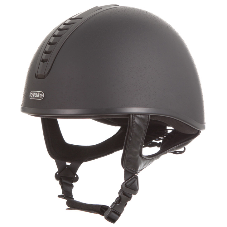Introducing the jockey skull, the Orion JS4K. Available in a stylish, all-black sanded design, the Orion JS4K is the ultimate choice for children looking for a safe, comfortable, and affordable jockey skull. The chrome ‘evoke’ logo finishes the look and is sure to look good with any colour hat silk.

Suitable for all equestrian disciplines including cross country.

Conforms to PAS 015: 2011 Standard; EN 1384 2023; ASTM F1163-23

Kitemarked to PAS 015: 2011
CE & UKCA marked
Lightweight ABS jockey Skull
Fully ventilated with stylised contrast panels and reinforcement mesh

Soft touch four-point adjustable leatherette harness with rear lacing