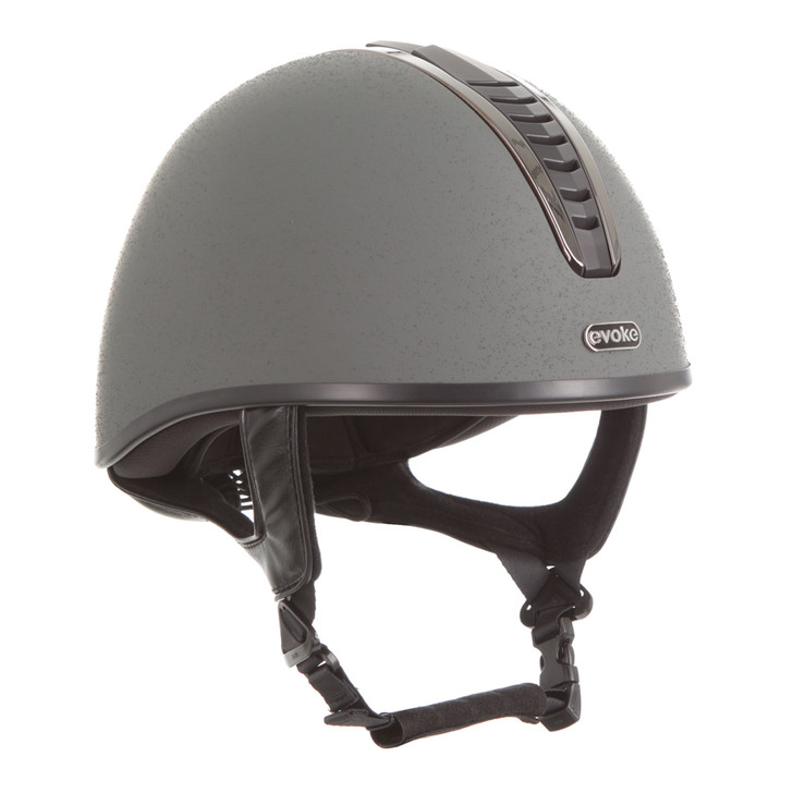 Introducing the stellar Orion Jockey Skull. Boasting an elegant gunmetal & black vent and sanded slate finish. A gunmetal ‘evoke’ branded logo at the forehead completes the look.
  
Conforms to PAS 015: 2011 Standard; EN 1384 2023; ASTM F1163-23

Kitemarked to PAS 015: 2011
CE & UKCA marked
Lightweight ABS jockey Skull
Fully ventilated with stylised contrast panels and reinforcement mesh

Soft touch four-point adjustable leatherette harness with rear lacing