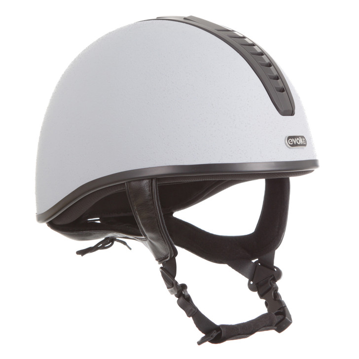 Introducing the stellar Orion Jockey Skull. Boasting an elegant silver & black vent and sanded silver finish. A silver ‘evoke’ branded logo at the forehead completes the look.
  
Conforms to PAS 015: 2011 Standard; EN 1384 2023; ASTM F1163-23

Kitemarked to PAS 015: 2011
CE & UKCA marked
Lightweight ABS jockey Skull
Fully ventilated with stylised contrast panels and reinforcement mesh

Soft touch four-point adjustable leatherette harness with rear lacing