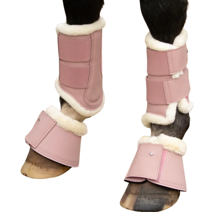 These pretty pink leather brushing boots are an adorable addition to any pony’s wardrobe! A super soft faux fur lining will keep your pony comfortable and help prevent rubbing. Protective inner strike pad to shield from knocks and scrapes and secured with easy fasten touch tape straps with Little Rider emblem.