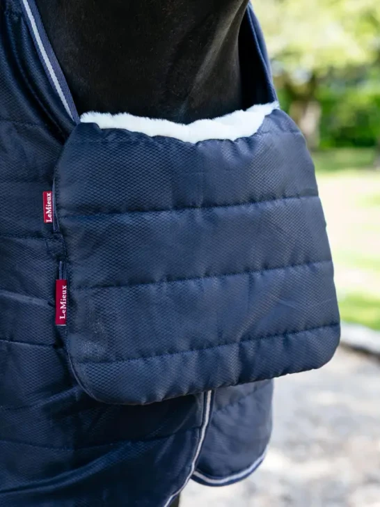 You'll wonder how you coped without this versatile, reversible protection pad! Its versatile functionality is perfect for whenever you need it.

Featuring deep pile faux fur on one side for extra comfort when layering rugs, it's ideal to protect your sensitive horse against rubbing at the chest - it tucks and folds over the front of the rug.

Compatible with all LeMieux rugs, it holds itself in position without the need for attachments or fixings.