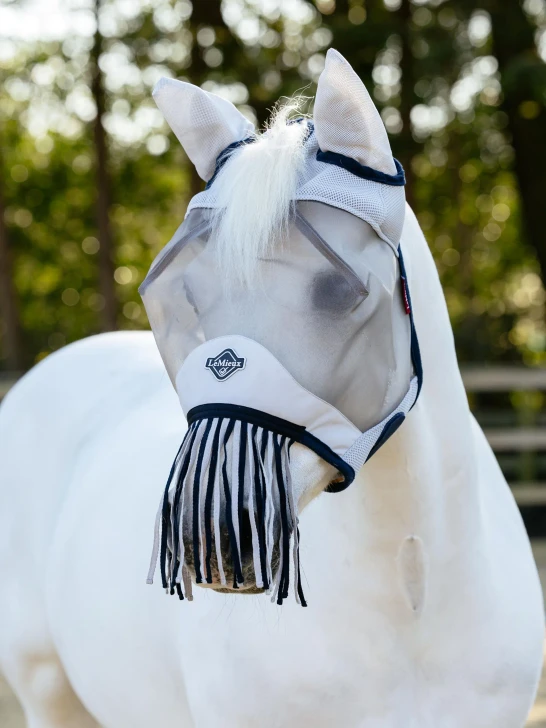 Fringe benefits! This eyecatching fly mask features a fleece bound edge across the nose with a nose fringe to keep flies at bay.

Micro-mesh ears, with fleece binding at the base of each ear, eliminate dust and flies with comfort. 

Across the eyes, 3D black spacer mesh assists your horse's vision in bright sunlight, standing out with plenty of room over the eyes for comfort and unrestricted vision.

A single hook and loop strap fastening makes easy work of putting on and taking off.