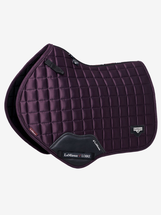 Described as the most stylish saddle pad LeMieux have ever produced. The Loire collection exudes sophistication and class - showing style without showing off! Woven Satin fabric gives a beautiful sheen to these pads whilst still benefitting from the wonderfully soft and breathable Bamboo lining.

The 100% natural Bamboo material controls heat & sweat and wicks very efficiently. The whole pad benefits from a new extensively researched soft friction-free suede binding which is specially fabricated to smoothly contour the edges. This new technique helps retain the perfect saddle pad shape and binding profile.

The textured pu leather girth protection area is complimented by an embossed logo and carries the usual signature LeMieux lower girth strap with its inner locking loops. The piece de resistance of the Loire Close Contact Square is its unique metal badge on a leather mount in the lower back corner