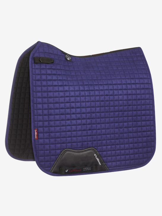 Now with our Super Soft Suede Binding & New PU Leather girth protection area, this beautiful suede Dressage square sets new standards in style & comfort. Designed to fit a wide range of dressage saddles with its high wither and elasticated D-Ring tabs. The luxurious suede top side with soft suede binding is complimented by a new super soft Bamboo lining to absorb & control sweat under the saddle and are beautifully comfortable and secure - minimising friction.
