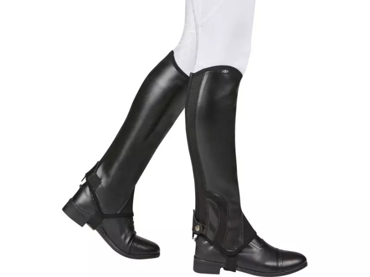 The Saxon Equileather Half Chaps are easy to care for, durable chaps with an elastic calf to ensure great fit. The equileather fabric offers a leather look at a great price.