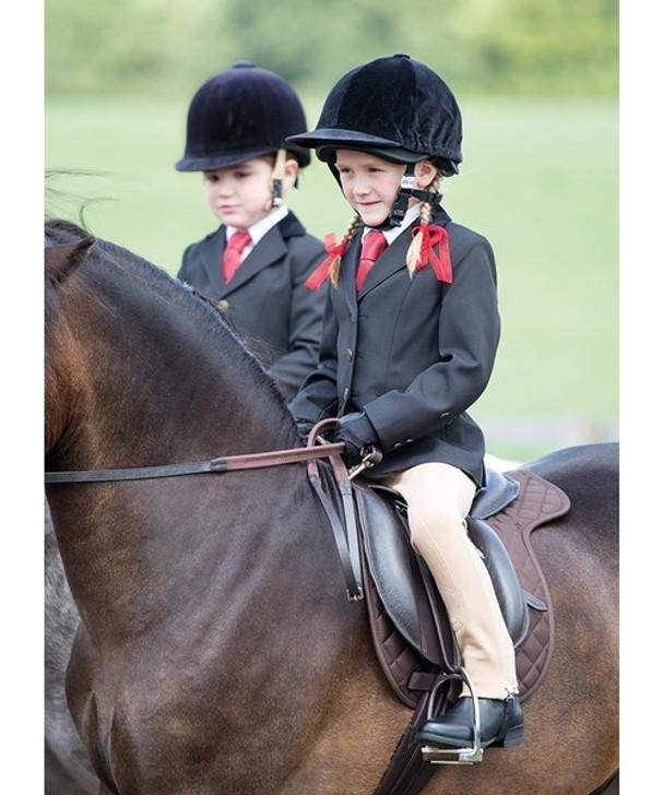 This classically shaped show jacket features smart tailoring along with velvet trimmed collar and pockets, double rear vents and brass colour button fastenings and cuff detail. Being hand washable means this jacket is super easy to care for. Double fastening for girls or boys fit.