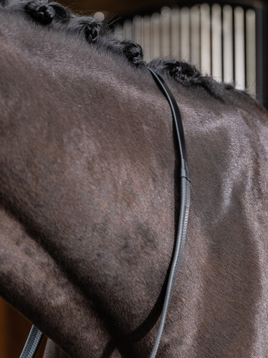 The LeMieux Rubber Reins are practical reins that have a light grip feel in the riders’ hands to suit any rider. With anti-slip texture for additional grip and nylon lining to prevent stretching.




Complemented by the branded Leather martingale stoppers.