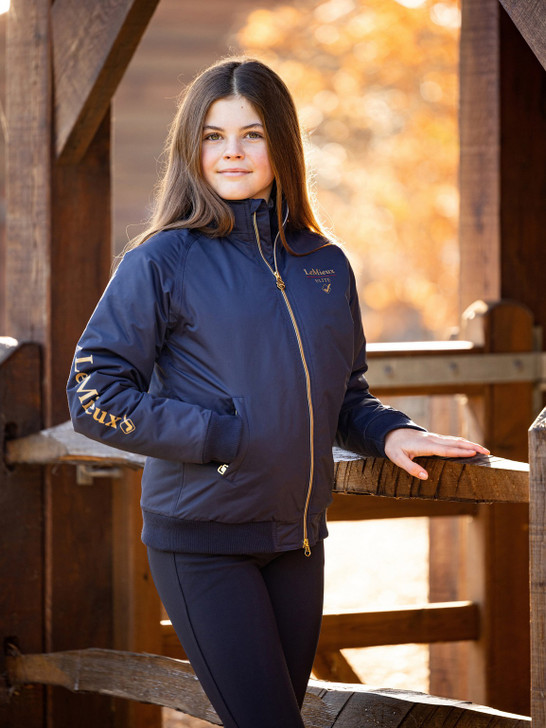 Practical in every way, this jacket is waterproof with fully taped seams and wind resistant too.
 

Underarm zipped ventilation keeps you cool when you need it, and the double collar provides added protection from the elements.
 

Practically designed with zipped pockets and gently elasticated hem and cuffs. Finished with gold metalwork and print detailing.
 

Personalise your jacket easily with a zipped entry for embroidery