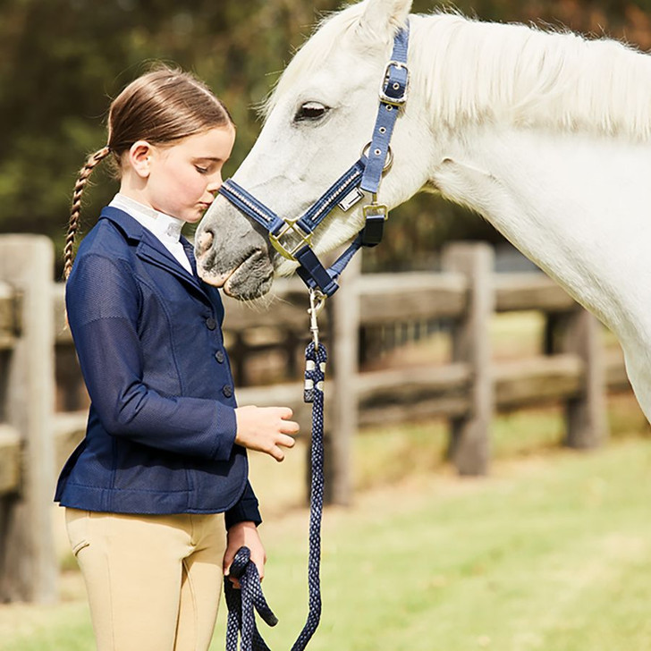 A stylish stretch mesh competition jacket perfect for those hot summer days competing. Featuring a flattering princess seam construction and double vented back with a hidden centre zip closure and 3 button detail on front. Hanger and garment bag included. 100% Nylon.