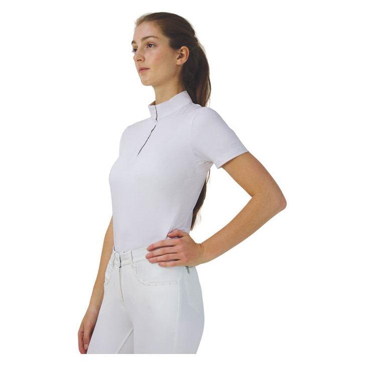 The stunning Suki Show Shirt is a classic short sleeved show shirt with a modern twist! Featuring mesh panels on the back for breathability and style, this shirt is the must have performance shirt for your competition wardrobe. With a white stand up collar, fastened by a zip and adorned with diamantes along the placket for that elegant touch. Diamantes also decorate the back of the show shirt for that subtle extra bit of bling across the mesh panels. A tonal Hy Equestrian logo is embroidered on the sleeve.