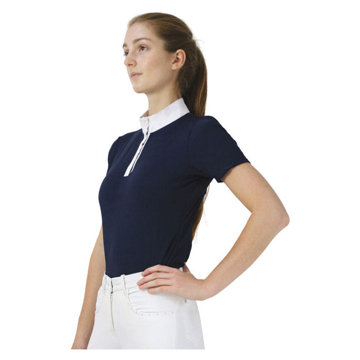 The stunning Suki Show Shirt is a classic short sleeved show shirt with a modern twist! Featuring mesh panels on the back for breathability and style, this shirt is the must have performance shirt for your competition wardrobe. With a white stand up collar, fastened by a zip and adorned with diamantes along the placket for that elegant touch. Diamantes also decorate the back of the show shirt for that subtle extra bit of bling across the mesh panels. A tonal Hy Equestrian logo is embroidered on the sleeve.