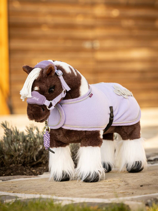 Dazzle is a gorgeous brown and white skewbald pony with fluffy feathers and a plaitable mane and tail. His coat is super soft – perfect for brushing and looking after.


He stands securely on all four legs and is flexible, making him safe for young children (3 years +) to play with.


Dazzle comes in his own posh horse box that turns inside out to become a luxury stable!


Of course, additional matching accessories are available for Dazzle in your favourite colours including saddle pads, fly hoods and polo bandages as well as fully working saddles and bridles in real leather, making these toys not only great fun to play with, but educational too!


Every pony is individually hand made, varying slightly in size and shape, and comes with its own passport and instructive care booklet. Does not include accessories, these are sold separately.


Suitable for ages 3 years +