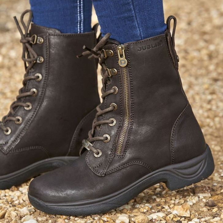 A short style country boot designed with comfort and practicality in mind. These boots feature a lace up front for an adjustable fit with a side YKK zip for easy on/off. Durable lightweight Tough Tec rubber outer sole designed to last, a moisture wicking RCS footbed system with heel and arch support, and a waterproof booty lining keeps your feet dry and comfortable all day long.