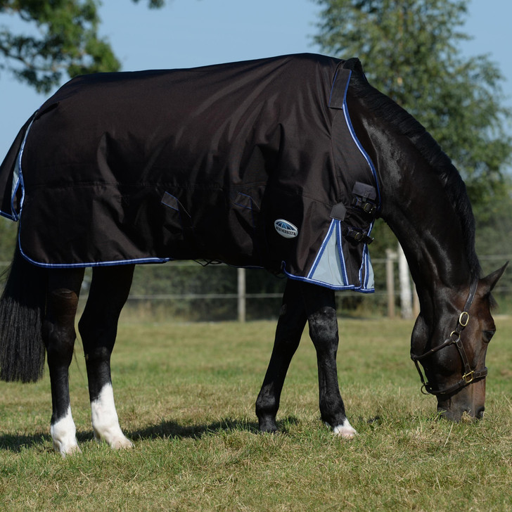 The snuggest rug we've ever made! As a top of the range rug, the WeatherBeeta ComFiTec Ultra Cozi II Detach-A-Neck Medium/Lite is packed with extra features. This style is compatible with the WeatherBeeta liner system to allow for versatility throughout the seasons, a WeatherBeeta Cozi guard for unbeatable protection of the neck and chest, removable and waterproof snug fit for ultimate warmth and protection of the horse's neck and memory foam wither relief pad that contours to the horse's shape and lifts the rug off the wither to reduce rubbing and provide added comfort. Plus, ultimate strength 1680 denier ballistic nylon outer shell with Teflon coating that is both waterproof & breathable, with quick clip front closure offering maximum adjustability, luxurious 100g lofty polyfill for warmth, which is easily identified with the NEW WeatherBeeta temperature gauge badge, and full wrap tail flap that has a two piece design with reflective insert that wraps around the horse quarters.