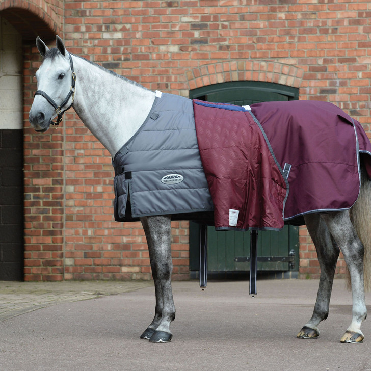 Comfortable, durable, remarkable value. The WeatherBeeta ComFiTec Plus Dynamic II Detach-A-Neck Medium/Lite comes packed with great features, including a super strong and durable 1200 denier triple weave outer shell with repel shell coating that is both waterproof and breathable, memory foam wither relief pad that contours to the horse's shape and lifts the rug off the wither to reduce rubbing and provide added comfort, quick clip front closure offering maximum adjustability and is compatible with the WeatherBeeta liner system. This rug also offers 100g of polyfill which is easily identified with the WeatherBeeta temperature gauge badge, also featuring a NEW extra large tail flap for maximum protection, reflective strips on front each side and tail flap for extra visibility, traditional side gussets for natural movement, twin low cross surcingles and elasticated, adjustable and removable leg straps for a secure and comfortable fit. Hydrostatic Pressure Tested to 2000mm plus.