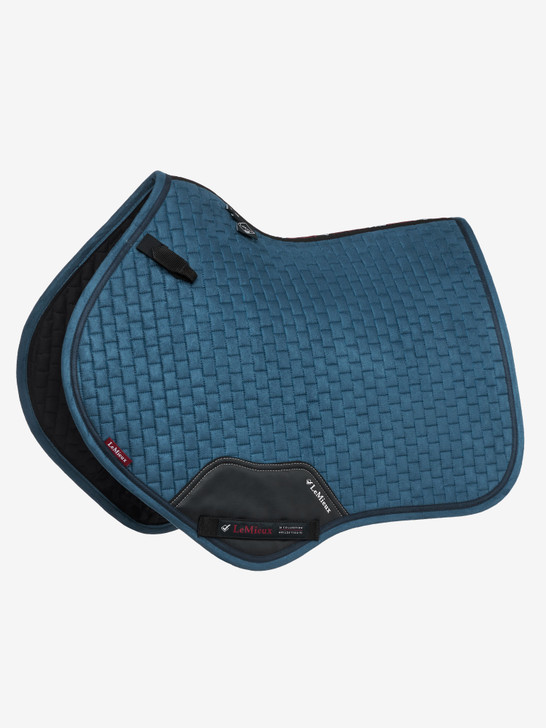 Now with a new super soft binding and new PU leather girth protection area, the classic close contact cut from LeMieux is designed to fit a wide range of more forward cut jumping saddles. Now one if the most iconic jumping pads with its high wither, elasticated D-ring tabs and swept back profile. These saddle pads offer a very sleek and professional look to anyone's saddle. The luxurious suede top side and new soft suede binding is complimented by super soft bamboo lining which absorbs & controls sweat under the saddle and is beautifully comfortable and secure - minimising friction even on sensitive skinned horses. Girth keepers incorporate inner locking loops to offer more girthing options.