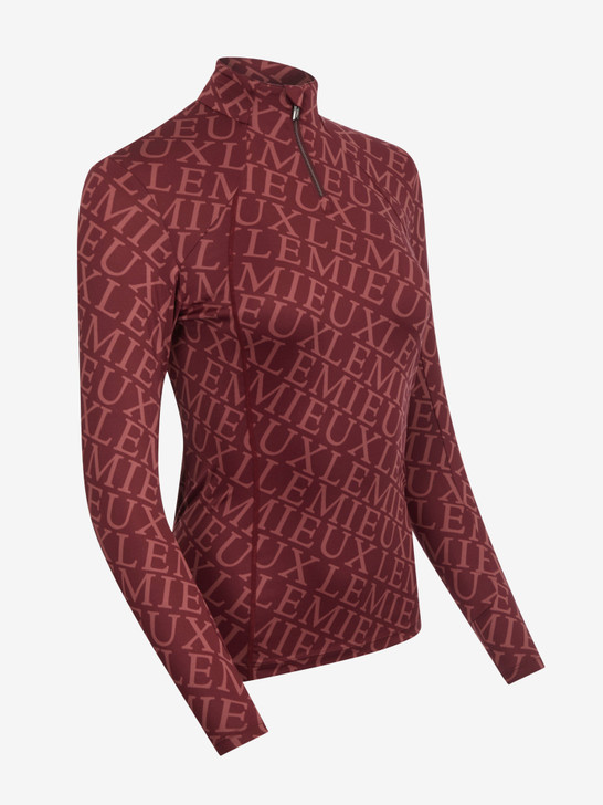 Add a touch of luxury to your riding wardrobe with our Fleur Base Layer. Finished with a striking all-over LeMieux print, this comfortable layer features movement-enhancing 360° stretch for unrestricted freedom, whatever the activity.

The form-fitting shape, ultra-soft seams and flat lock stitches reduce bulk and prevent chafing while you move, making it easy to layer under fleeces, jackets and gilets. If you're wearing it as a stand-alone sports layer, 30+ UV protection will protect you on sunny days.