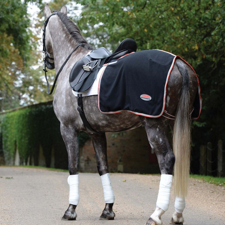 The WeatherBeeta Therapy-Tec Fleece Quarter Sheet is designed to just cover the horse's quarters and finish behind the saddle so not to interfere with the rider's leg. Features include ceramic fabric technology to reflect the horse's own body heat; touch tape strap that attaches to the girth straps on the saddle, making this easy to remove at home or competitions. Therapy-Tec increases your horse╔s muscle function to reduce the risk of injury while warming up, by preparing the muscles for exercise and assists in recovery after work by reducing lactic acid build up which can decrease recovery time & improves the healing process of prior injuries.