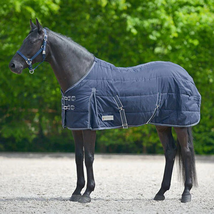 The Mackey Stable Rug 200g has a thermal filling for cool days. Ideal fit due to anatomical cut to central back seam. 300 denier polyester. Perfect Fit due to anatomical cut along central back seam. Breathable. Multi-adjustable front fastening. Padded withers. Kick pleat. Cross surcingles. Fillet string.