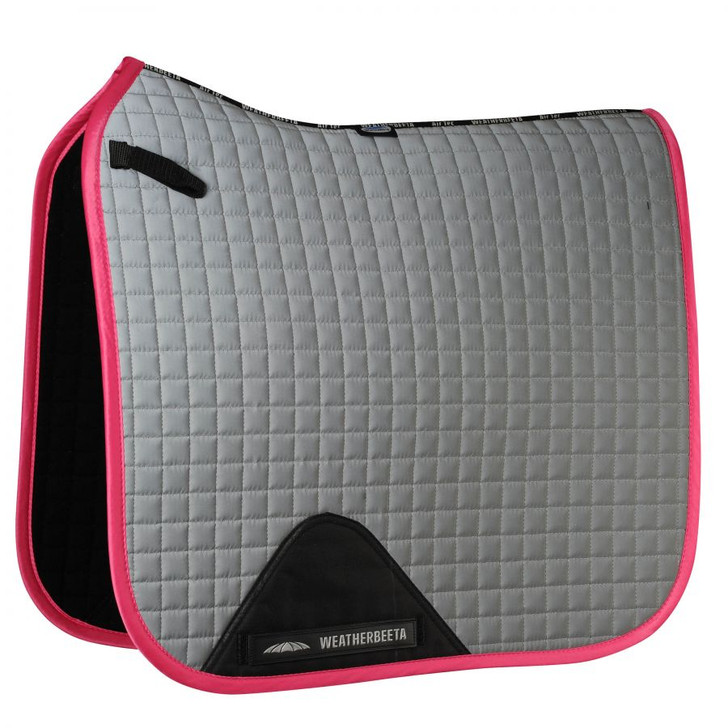 The WeatherBeeta Reflective Prime Dressage Saddle Pad is a durable cotton pad with a polyester wick easy lining helping to keep your horse cool, dry and comfortable. Highly reflective for safety, the breathable mesh spine allows extra airflow to your horse's back, whilst the high wither design provides extra space where needed to help prevent pressure spots. The covered girth patch offers durability and girth loops allow for a secure fit. Attachment to the D-rings is made simple with short touch tape loops for a secure fit under saddle. Machine washable at 30 degrees. DO NOT tumble dry. Matching range available. Comes in Pony and Full sizes.