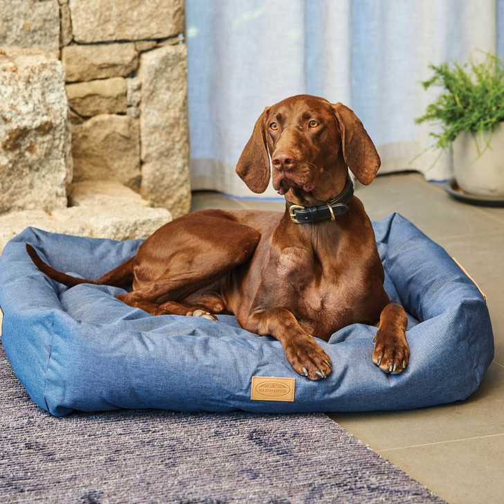 Super strong and stylish dog bed. Made with a strong 600 denier waterproof coated outer fabric on the upper and pillow with faux leather handle. Inner has a soft and naturally breathable cotton polyfill. A cosy and modern feature in any home.