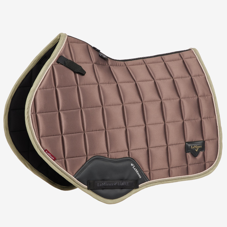 Described as the most stylish saddle pad LeMieux have ever produced. The Loire collection exudes sophistication and class - showing style without showing off! Woven Satin fabric gives a beautiful sheen to these pads whilst still benefitting from the wonderfully soft and breathable Bamboo lining.

The 100% natural Bamboo material controls heat & sweat and wicks very efficiently. The whole pad benefits from a new extensively researched soft friction-free suede binding which is specially fabricated to smoothly contour the edges. This new technique helps retain the perfect saddle pad shape and binding profile.

The textured pu leather girth protection area is complimented by an embossed logo and carries the usual signature LeMieux lower girth strap with its inner locking loops. The piece de resistance of the Loire Close Contact Square is its unique metal badge on a leather mount in the lower back corner