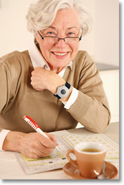 elderly woman with emergency alert system button