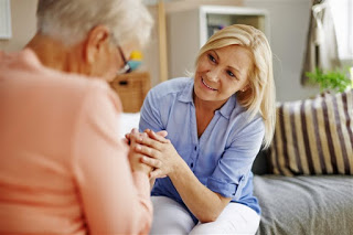 elderly woman talking with daughter