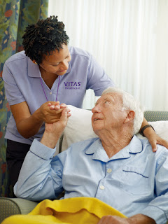 caretaker with elderly man on hospice