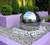 20 inch Stainless Steel Sphere on Rock Garden on Tiered Landscaping