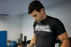 Revgear Rash Guard in black, showcasing the front design and compression fit