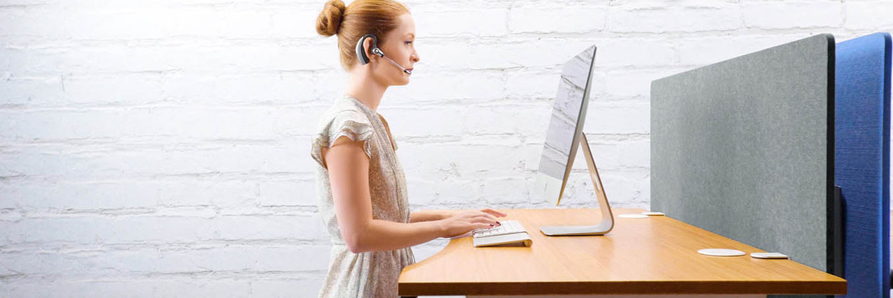Standing at a height adjustable desk