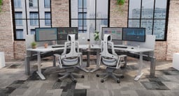 Office outfitted with UPLIFT Desk products. Seamless workspace using 120-Degree desks and a Power and Data Rail