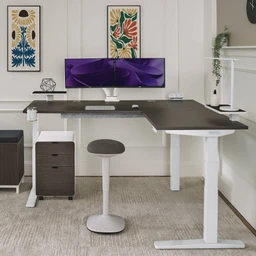Upgrade your corner office by pairing the Engage Stool with an UPLIFT L-Shaped Standing Desk and make room for movement in your workflow 