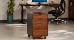 File cabinet by UPLIFT Desk featuring walnut laminate drawer fronts