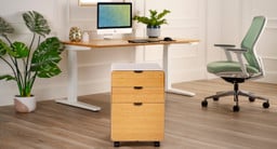 Office with the focal being a file cabinet with bamboo drawer fronts by UPLIFT Desk