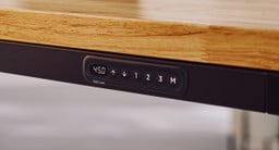 Modern simplicity in action. Adjust your desk height while maintaining a clean, uncluttered surface