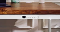 Modern simplicity in action. Adjust your desk height while maintaining a clean, uncluttered surface