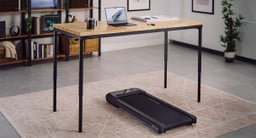 Warm wood tones and architectural black accents meet, creating a sophisticated environment designed for both productivity and movement