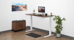 UPLIFT 2-leg Standing Desk in white with a Walnut Heights Custom Laminate desktop.
