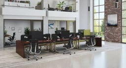 Delivers a cohesive finish across connected desks. Material shown: Figured Mahogany