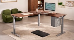 Deep Desk Drawer installed on an L-shaped desk, showing a seamless match with the black standing desk frame