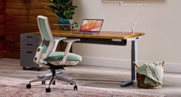UPLIFT 2-leg height adjustable desk and an Envoke Ergonomic Chair.
